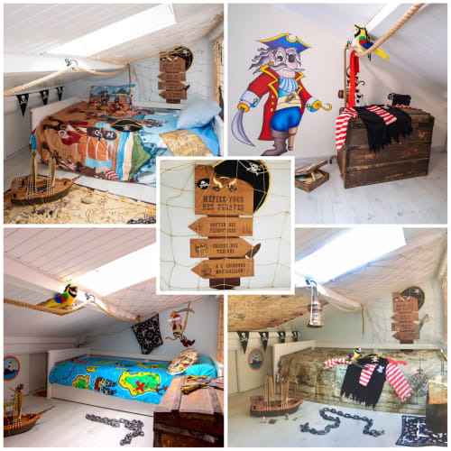Chambre pirate Le Pirate Benèze avec décor nautique, cartes au trésor et œuvres d'art colorées à Trizay