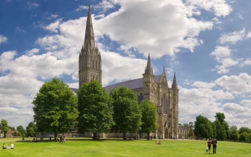 Salisbury Cathedral with green grounds near Blandford Forum accommodation