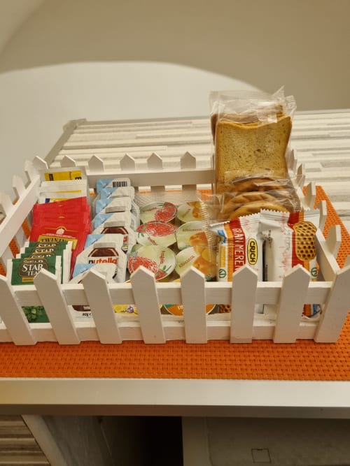 Welcome basket with bread, snacks and spreads at B&B Il Conservatorio, Naples apartment