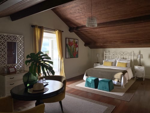 Spacious bedroom suite at Villa Várzea with wooden beams, white metal bed, turquoise seating, and golden curtains overlooking