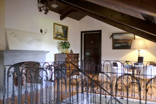 Charming Suite loft at Villa Várzea with decorative iron railing, fireplace, and mountain views