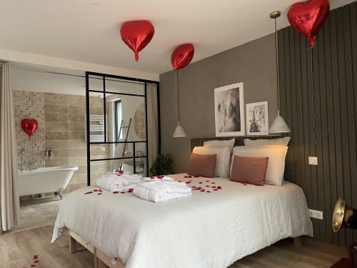 Bedroom decorated with romantic option, heart balloons
