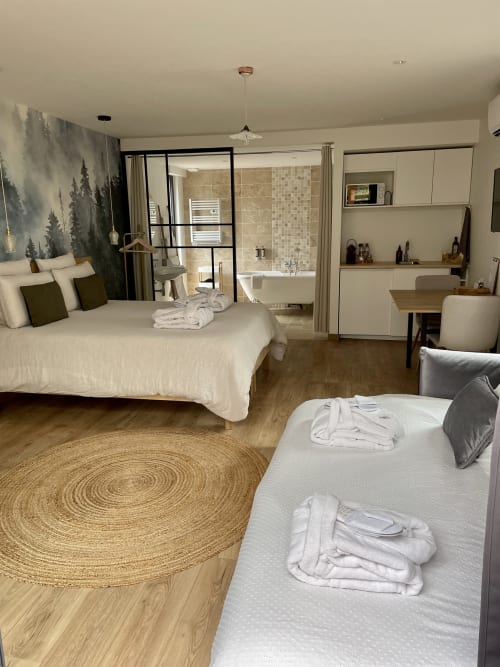 Wide bedroom view with round jute rug