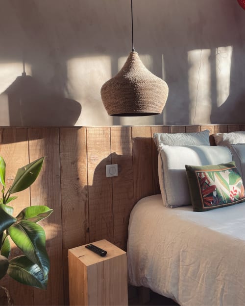 Cozy bedroom in private spa lodge with bohemian decor