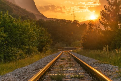Train tracks at sunset with mountains and forest near Limavady, GB accommodation