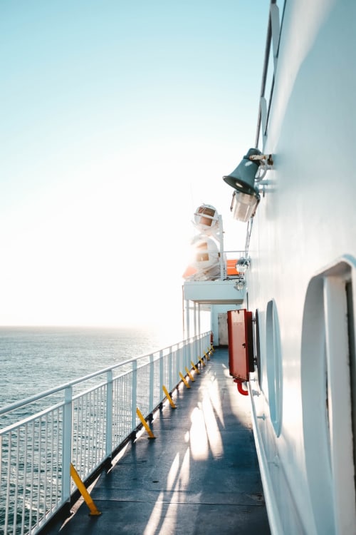 Ferry deck railing overlooking calm sea near Limavady, Northern Ireland