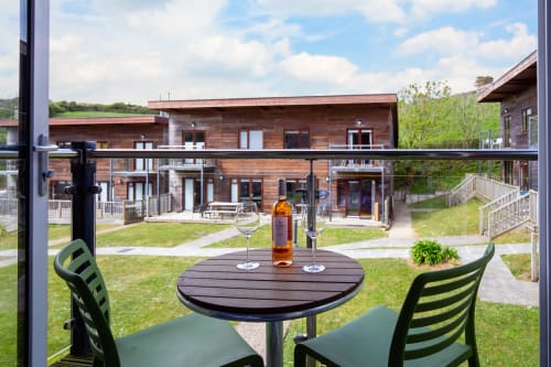 Cornish Holiday Bodannon, balcony, A lovely view with a bottle of wine glasses, table and chairs for relaxing and watching the world go by.