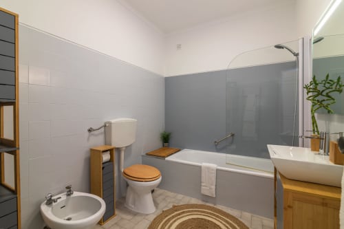 bathroom with bath tub | Sand & Sea Apartment – Modern Living with Ocean Views