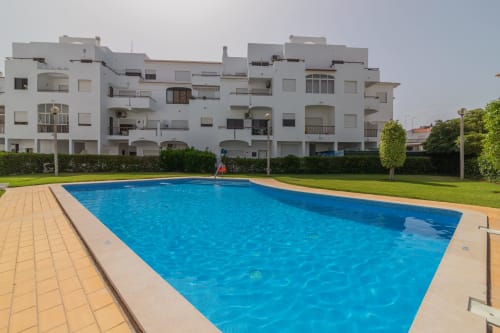 outdoor swimming pool | Sand & Sea Apartment – Modern Living with Ocean Views