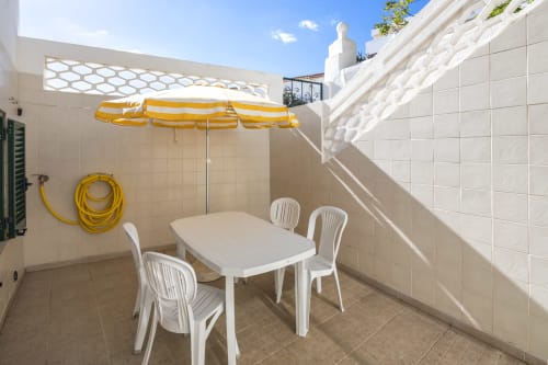 outside table and chairs | Casa da Vila Apartment – Traditional Charm in Albufeira Old Town