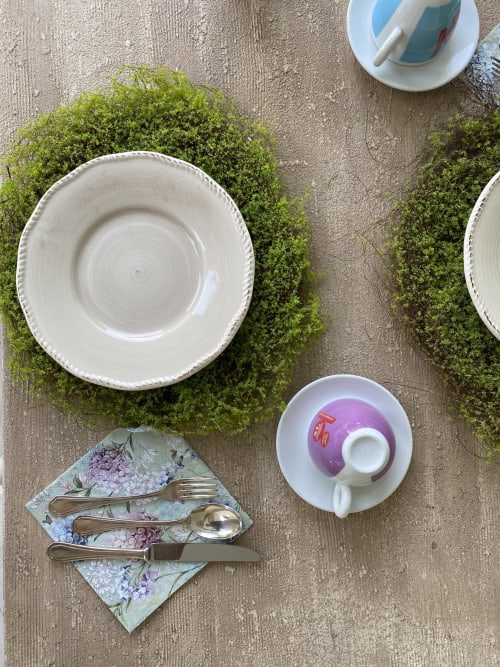 Verdolivo B&B table setting with white plates, moss detail, floral napkin and silverware in Sale Marasino