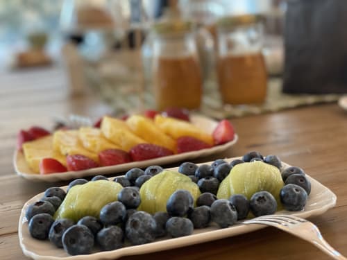 Fresh fruit platters with blueberries and grapes at Verdolivo B&B in Sale Marasino, Italy