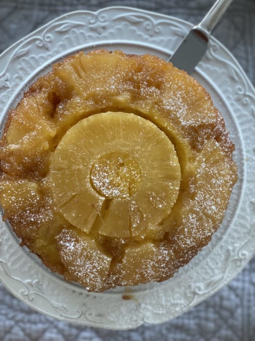 Pineapple upside-down cake dusted with powdered sugar at Verdolivo B&B in Sale Marasino