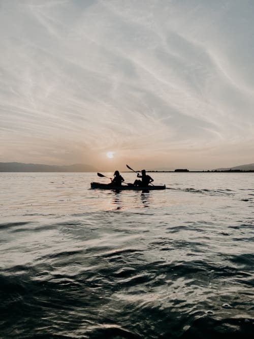 Canoeing on the sea at dusk.