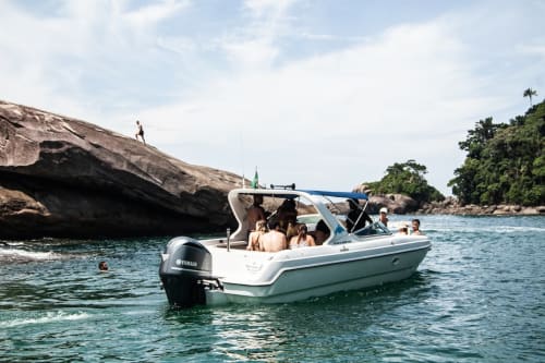 A speed boat with holiday makers on it.