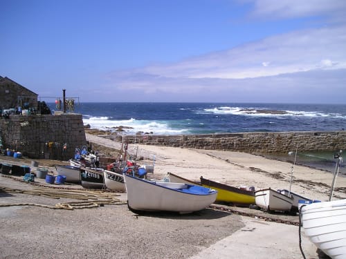 Boats at Sennen Cove in Cornwall. A lovely day with blue sky. Picture credit - Cornish Holiday.