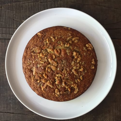 Walnut cake on white plate at Maison Mûrier bed and breakfast in Fayssac, France