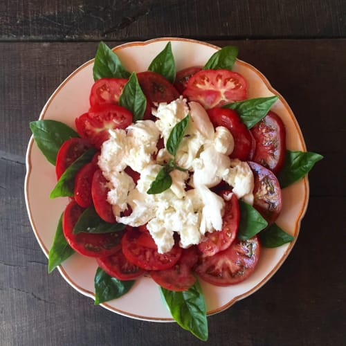 Caprese salad with fresh tomatoes, mozzarella, and basil at Maison Mûrier B&B in Fayssac