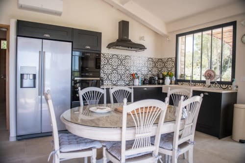 Modern equipped kitchen and dining area at Bastide Toujours Dimanche, Gordes, Provence, Luberon, France.