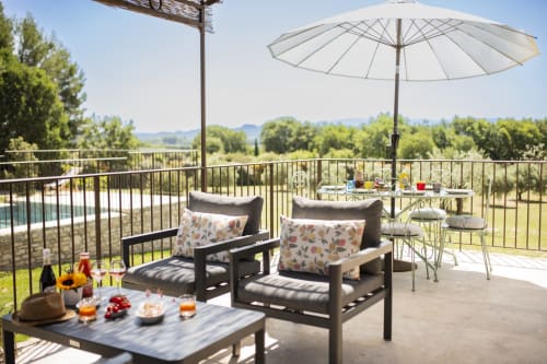 Peaceful and shaded terrace, art of living in Provence with a view of the Luberon at Bastide Toujours Dimanche, Gordes, France.