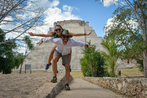 a joyful couple having fun in chichen itza