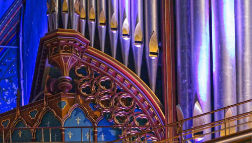 Ornate Gothic architectural detail with blue and purple lighting at Au Gite d'Isigny, Isigny-sur-Mer