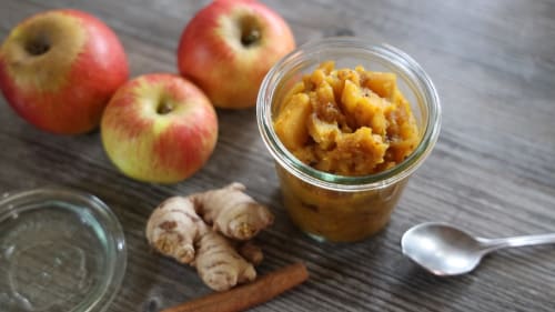 Homemade apple butter in jar with fresh apples and ginger at Maison Mûrier, Fayssac