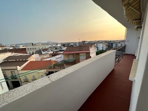 Terraza del hotel Gestyp-AT con vistas a los tejados de Mérida al atardecer