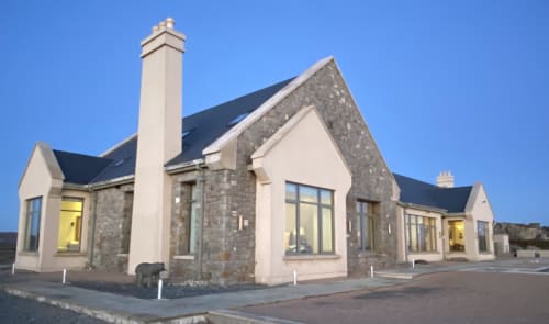 Seabrook Lodge hotel exterior in Clifden, Co. Galway, Ireland - modern stone and white building with pitched roofs and large