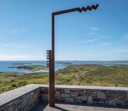 Seabrook Lodge viewpoint sign overlooking Clifden coast with islands and green hills in Galway, Ireland