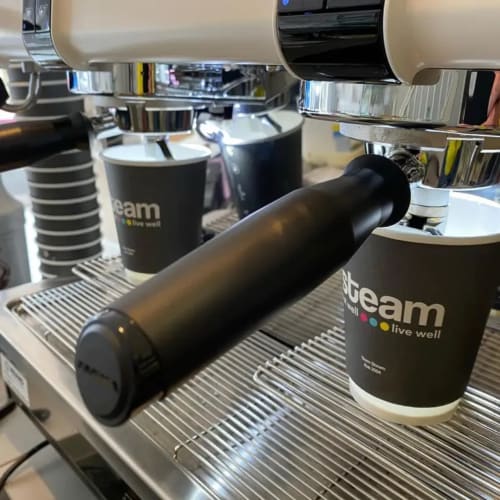 Steam branded merchandise and drinkware displayed on espresso machine at Seabrook Lodge, Clifden