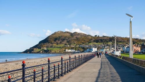 Bray seafront promenade with beach, pier, and coastal town views, ideal for guests at Eglinton Road