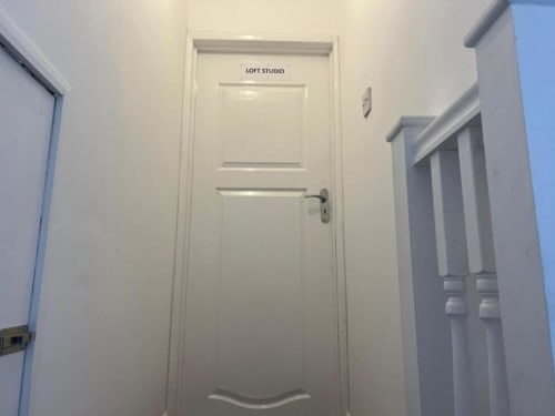 Loft Studio entrance at Starlet Property London with white paneled door and hallway
