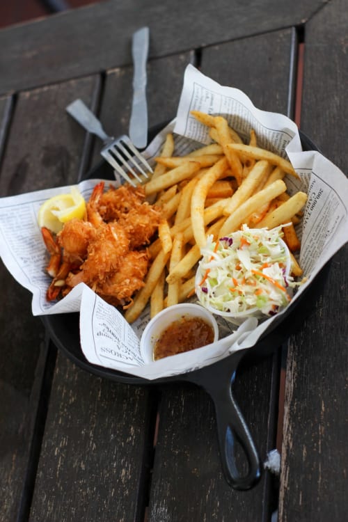 Crispy fried seafood with golden chips and coleslaw served at Dee-8 restaurant in West Kirby