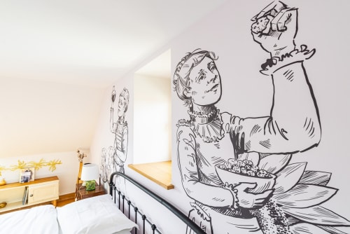 Bedroom at La Maison George with whimsical line-drawn mural of woman with flowers and vintage furnishings