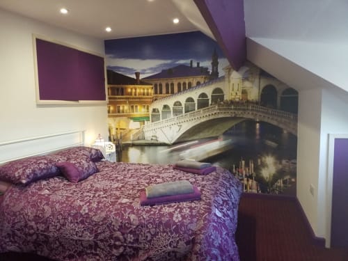 Bedroom with purple damask bedding and Rialto Bridge Venice mural in 4-bedroom Guisborough villa