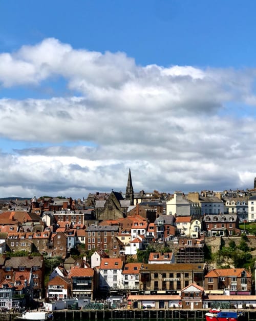 Guisborough coastal town skyline with historic buildings, church spire, and harbor - Jane's B&B location