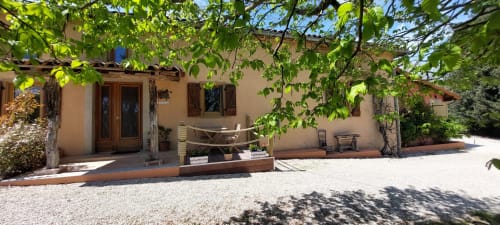 Les Gites de Campardon BnB entrance with courtyard, hammock, and shaded terrace in Monties, France