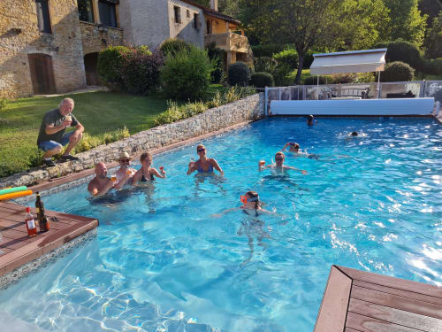 Guests enjoying the heated swimming pool at Domaine du Cardou