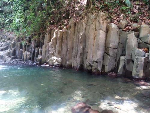 Pristine turquoise pool at natural rock formations, Gites villa Bagatelle, Sainte-Rose Guadeloupe