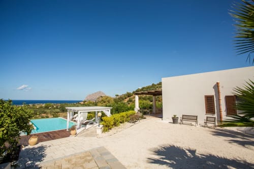 Luxury villa terrace overlooking Mediterranean Sea near Sant'Andrea, Valderice with pool and white architecture