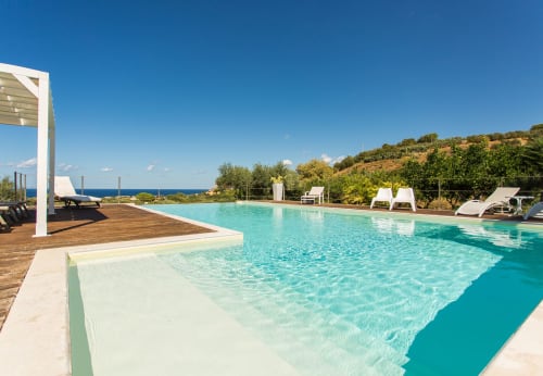 Luxurious infinity pool overlooking Mediterranean Sea at Villa Maria, Sant'Andrea Valderice
