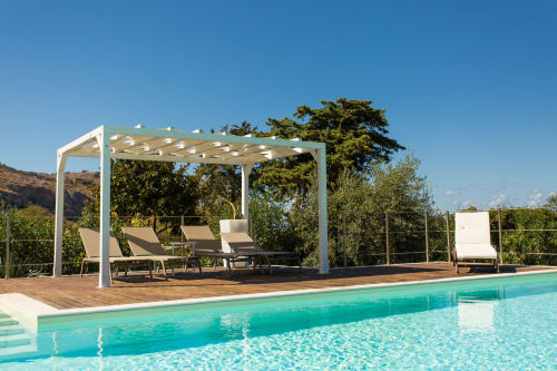 Modern poolside pergola with loungers at Villa Maria, Sant'Andrea Valderice Italy
