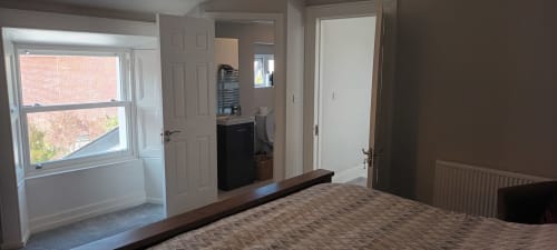 Spacious Super King ensuite bedroom at Eglinton Road Bray with window, flatscreen TV, and modern amenities
