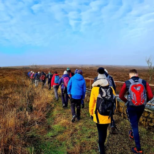 Group of hikers on moorland trail near Sliabh Beagh Hotel, Monaghan, Ireland