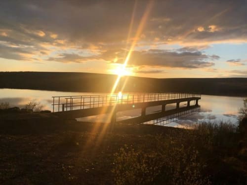Sunrise over a wooden boardwalk at Sliabh Beagh Hotel & Tourism Centre in Monaghan, Ireland