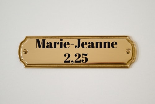 Brass door plaque for Marie-Jeanne room at Pavillon Des Millesimes hotel in Lussac, France