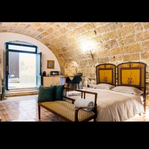 Sottano 2 apartment at CorteLirice Paradiso with arched stone ceiling, twin beds, and direct courtyard access