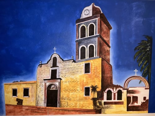 Arquitectura colonial española histórica en La Paz, Baja California Sur, con muros de piedra amarilla y campanario de ladrillo rojo