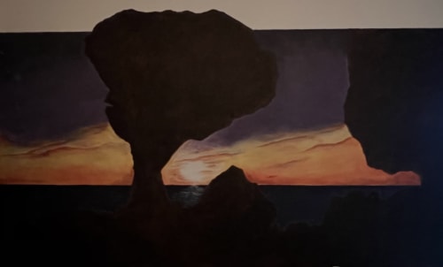 Silueta del árbol icónico al atardecer desde la habitación del Hotel Boutique BajaReal en La Paz